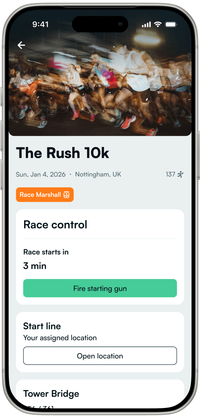 The RunnerBeam marshal race control screen on iPhone, with the starting gun ready to fire
