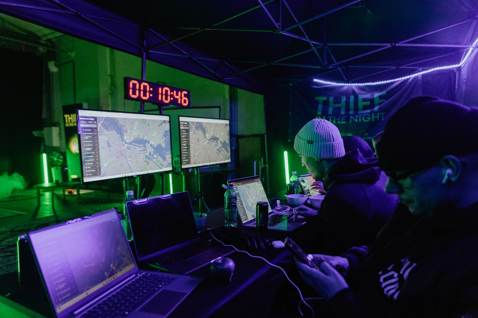 Race control tent at Thief in the Night with live tracking maps and a race clock